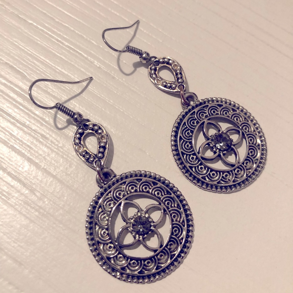 Decorative circle coin earrings with gemstone in the middle.
